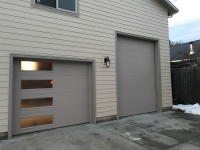 tall 5 panel and half lite 4 panel residential garage door installation