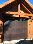 embossed dark wood single residential garage door installation
